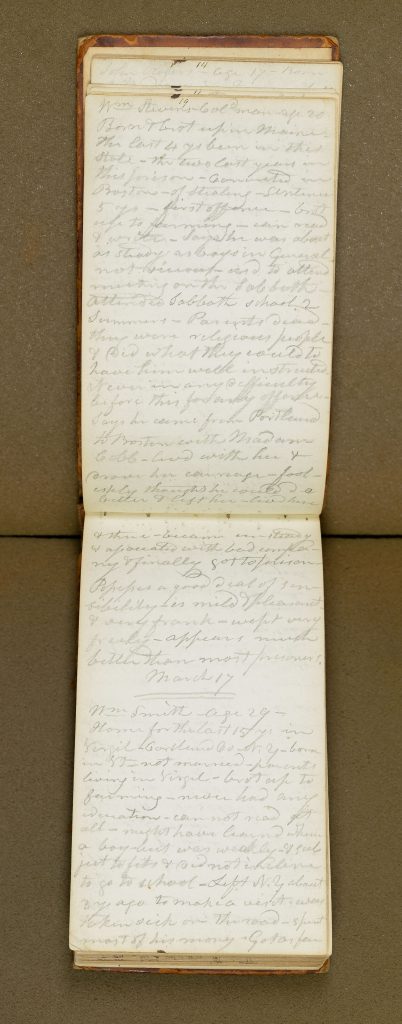 open notebook with handwritten pencil notes