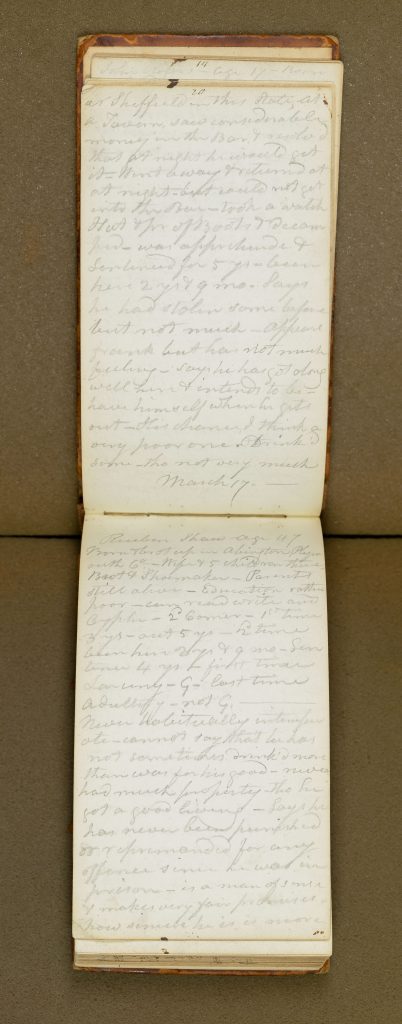 open notebook with handwritten pencil notes