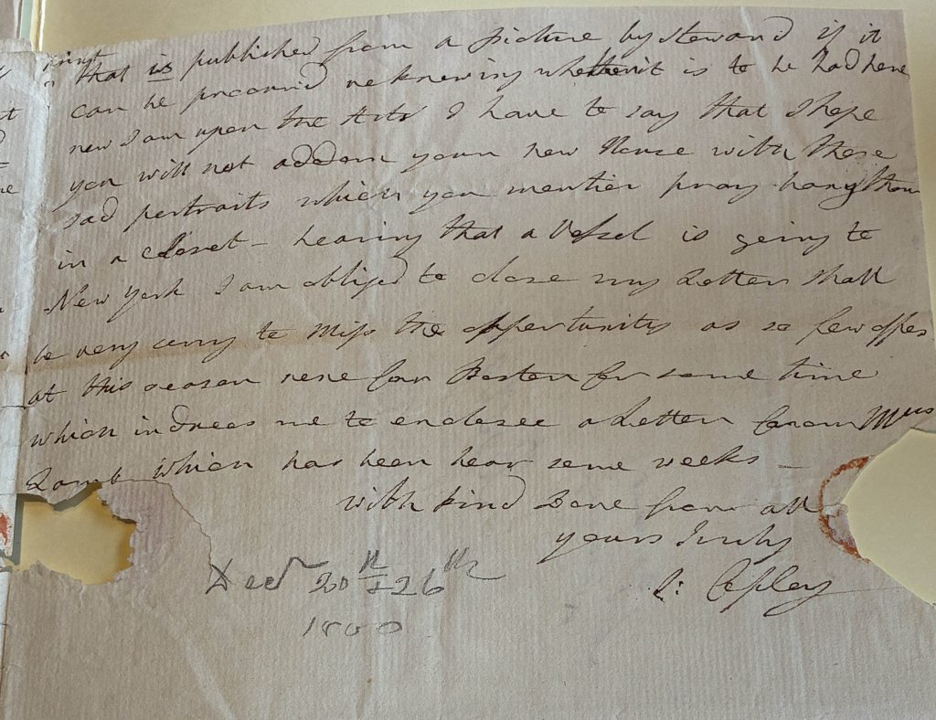 Handwritten letter in ink with some holes in the paper.