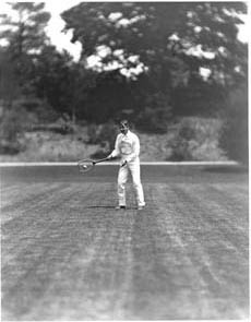 Tennis player, possibly Edward L. Hall, in motion Photograph