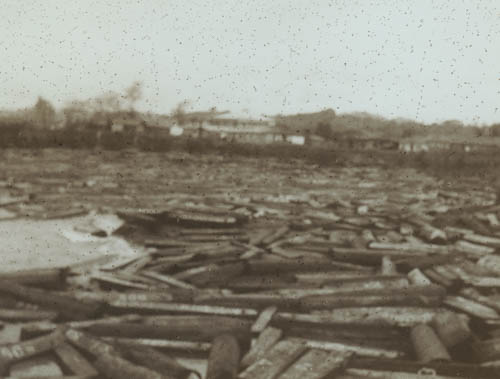 Logs in cove awaiting shipment Lantern slide