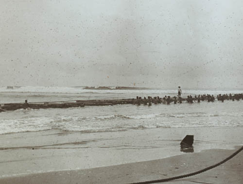 Raft clearing the beach Lantern slide
