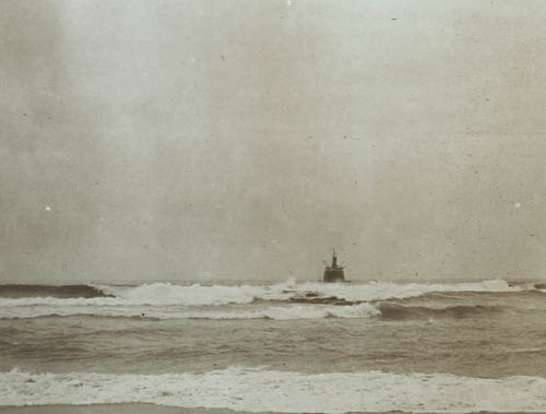 Raft in midst of the surf Lantern slide