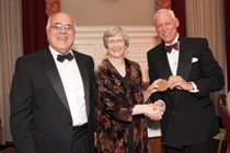 Ulrich accepts the Kenndy Medal from Dennis Fiori and Bill Clendaniel